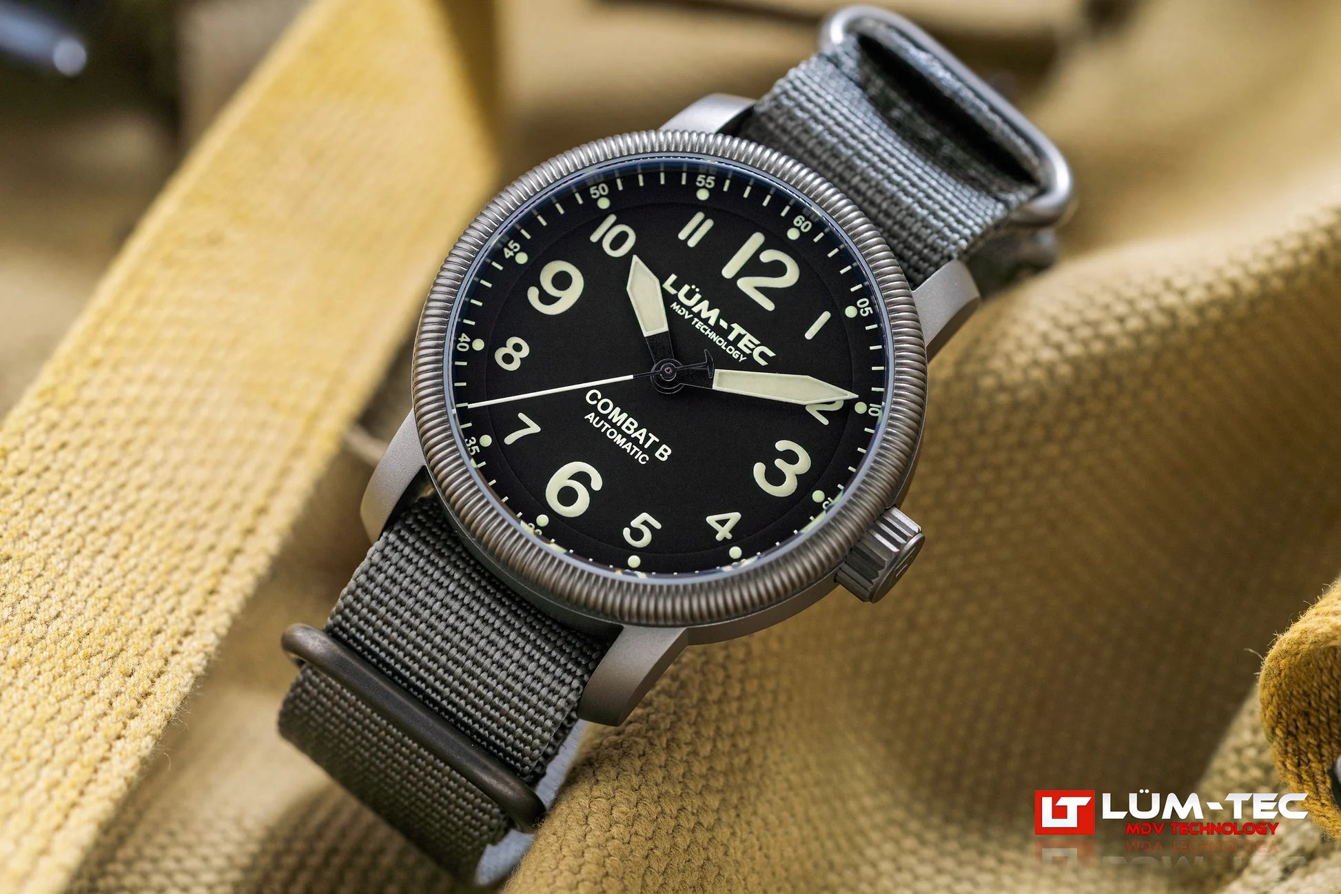Lum-Tec Combat B69 Automatic angled view showing gunmetal PVD case