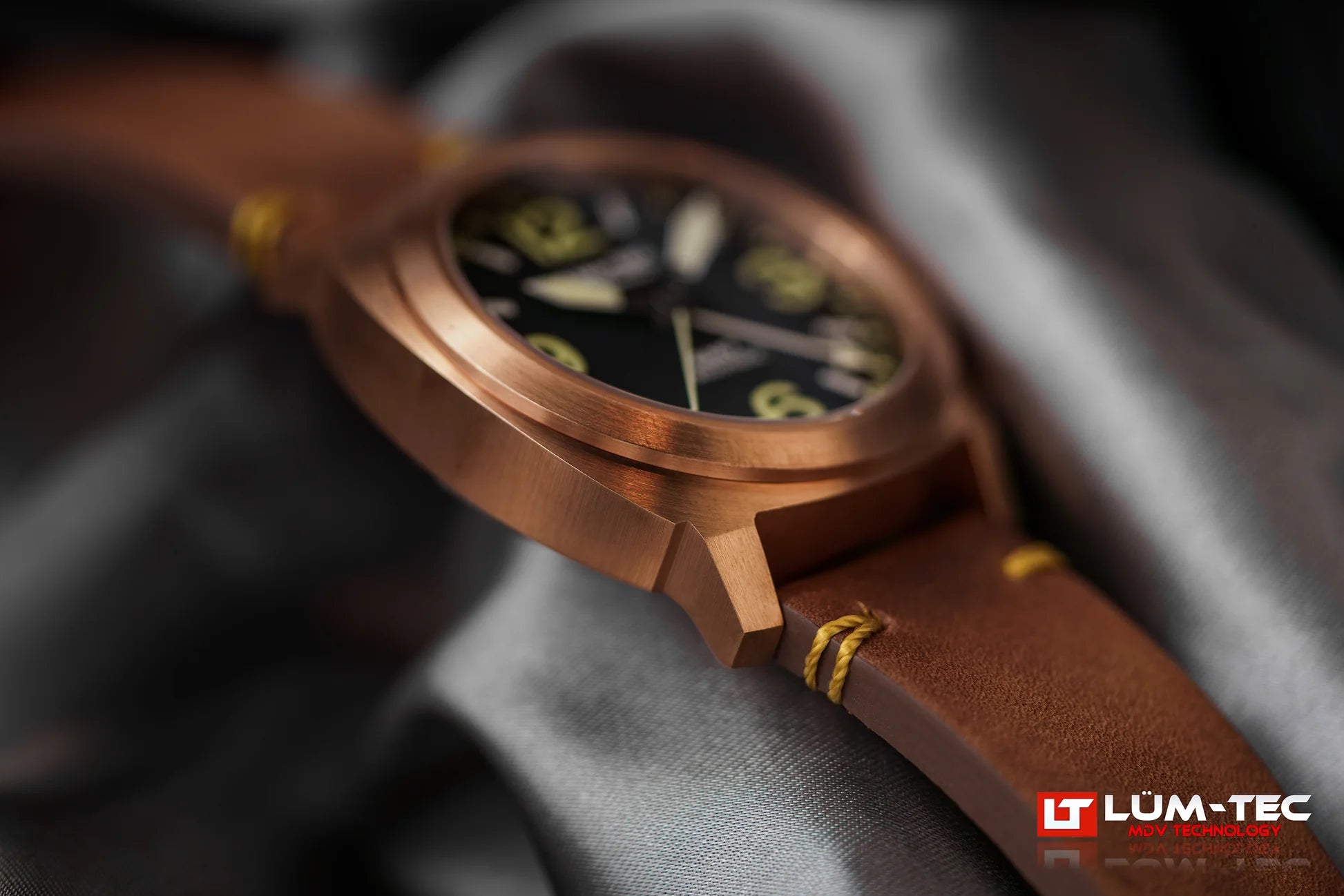 Lum-Tec M94 Bronze GMT side profile showing brushed bronze case and brown leather strap