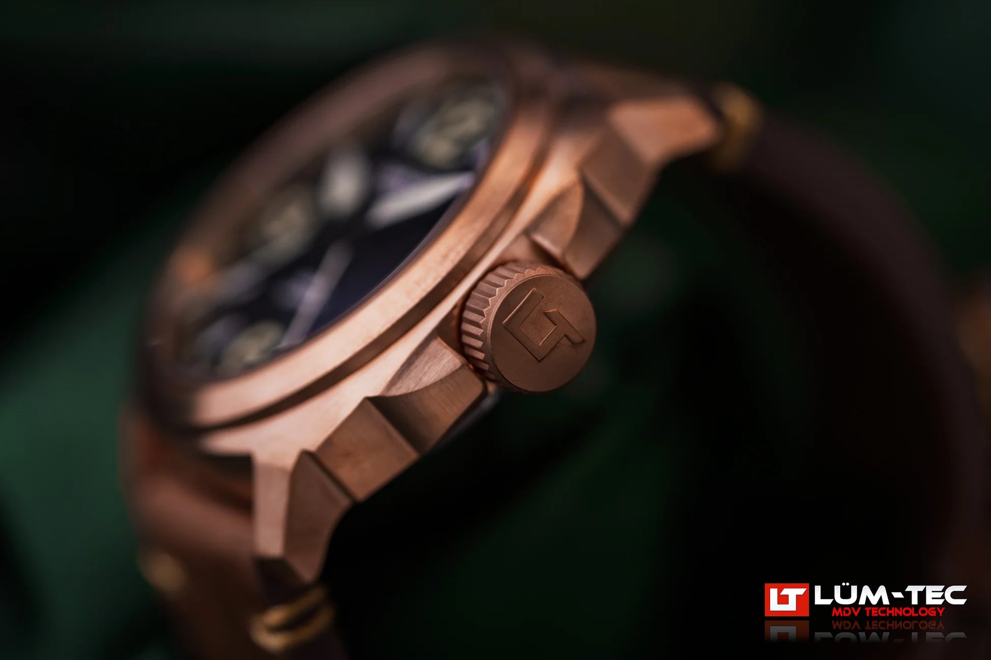 Macro shot of Lum-Tec M94D Bronze showing brushed bronze case, crown, and leather strap