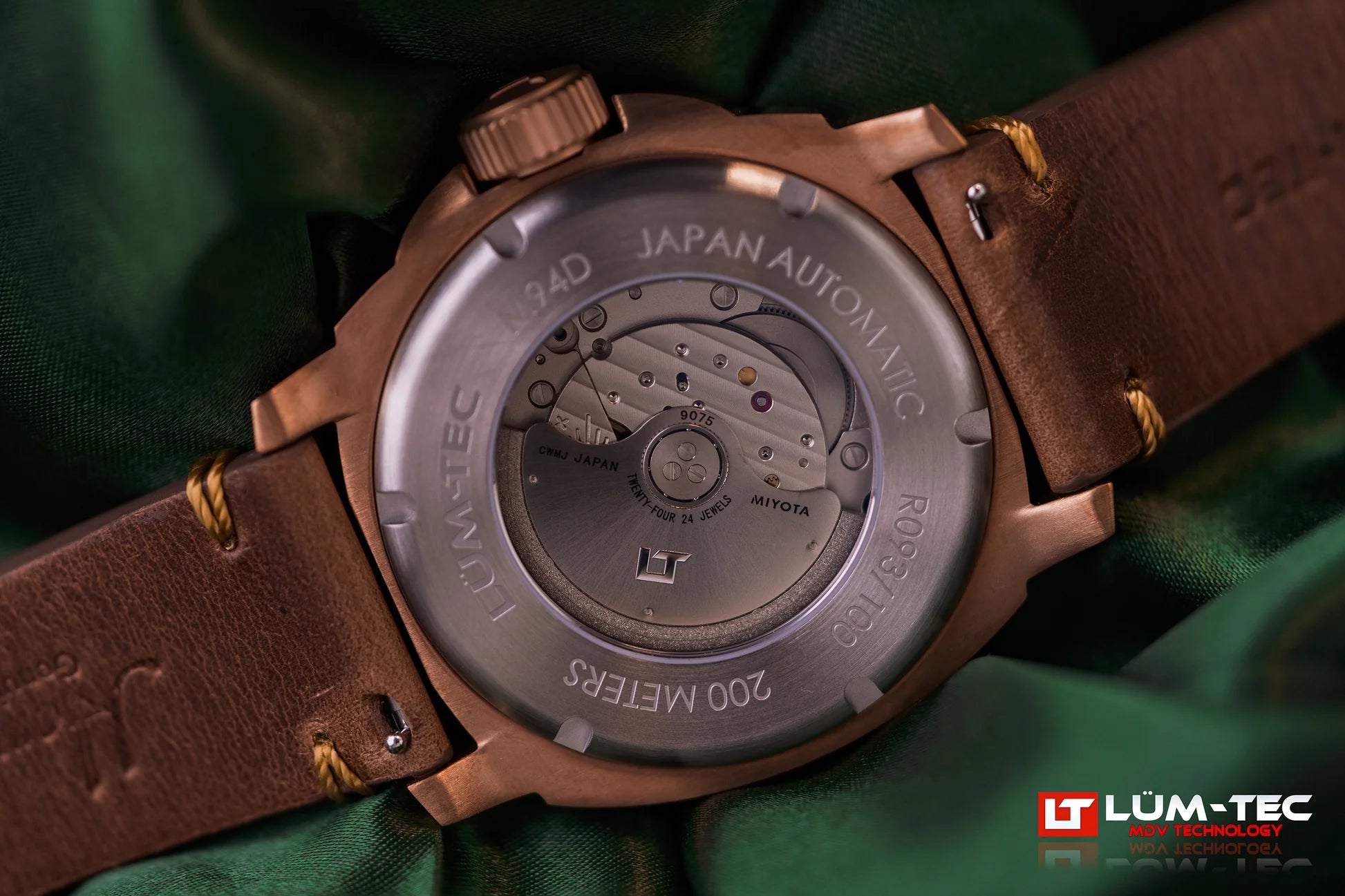 Macro shot of Lum-Tec M94D Bronze caseback with sapphire crystal revealing Miyota GMT movement